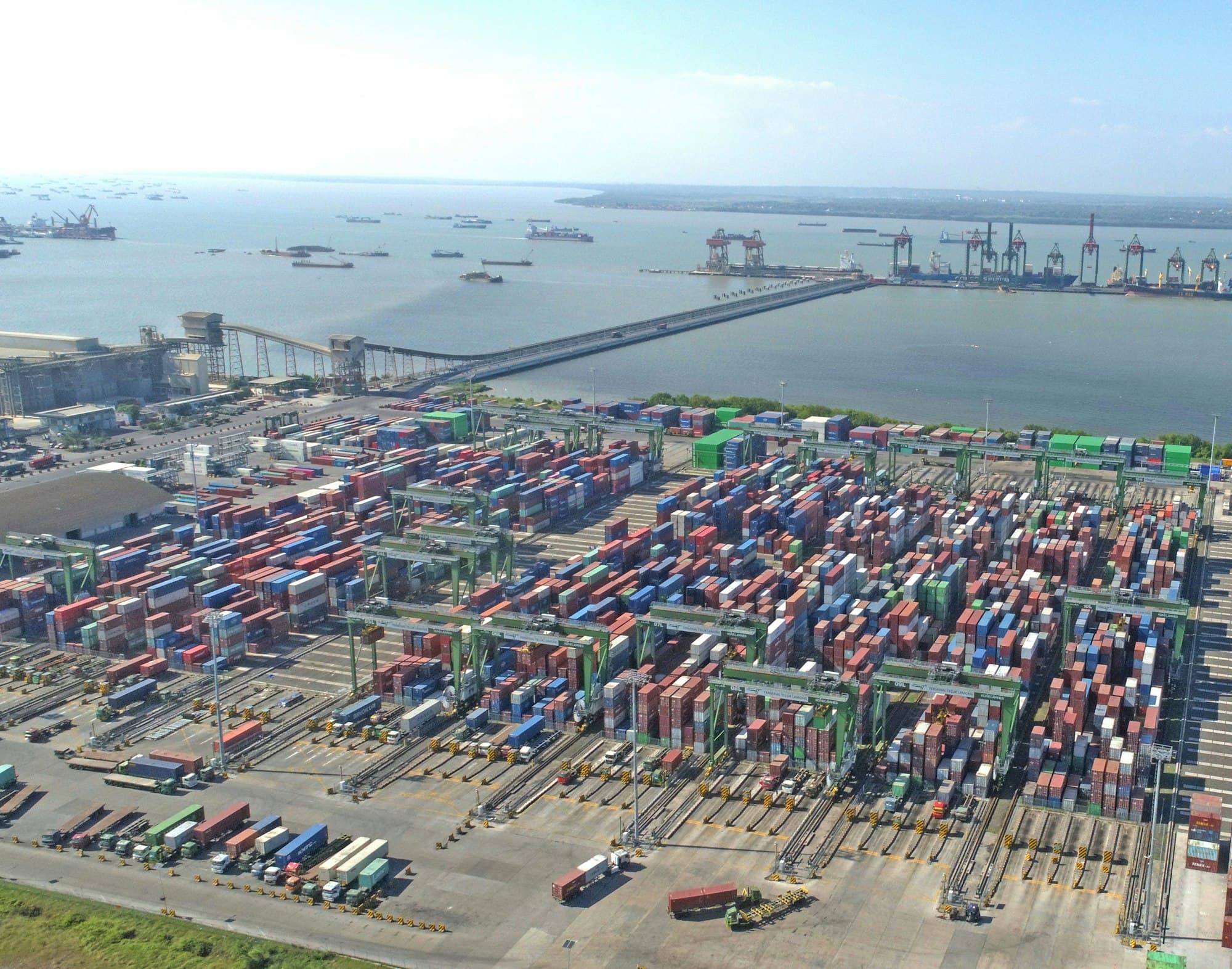 Aerial view of a busy shipping port with containers